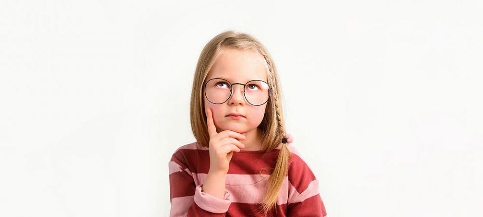 Little girl wearing glasses and thinking about life insurance and types of life insurance