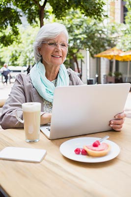 Senior woman looking up how to invest in life insurance settlements
