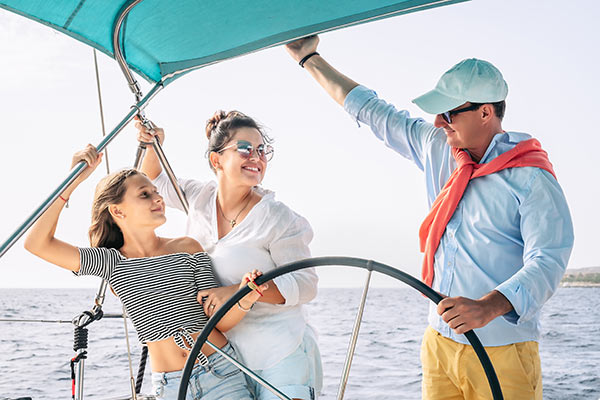 Wealthy family having fun on a sailboat