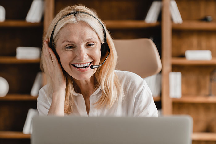 Life insurance representative helping a client on the phone.