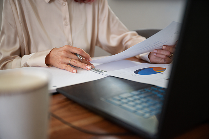 Woman reviews financial plan to decide if converting from term to permanent life insurance is right for her